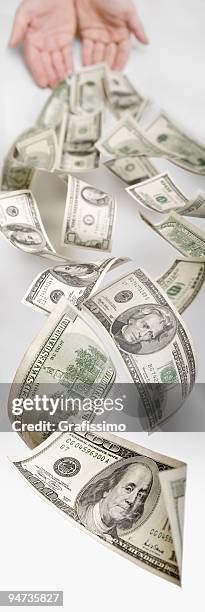 dollars flying through the space - money down the drain stock pictures, royalty-free photos & images