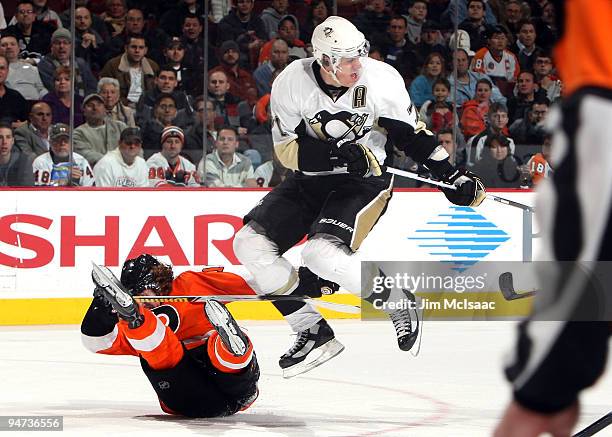 Evgeni Malkin of the Pittsburgh Penguins leaps to avoid Scott Hartnell of the Philadelphia Flyers on December 17, 2009 at Wachovia Center in...