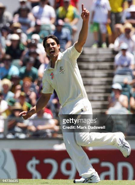 Mitchell Johnson of Australia celebrates the wicket of Narsingh Deonarine of the West Indies during day three of the Third Test match between...