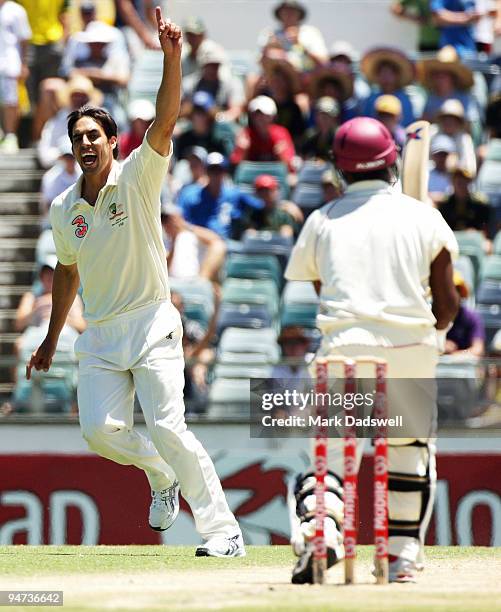 Mitchell Johnson of Australia celebrates the wicket of Narsingh Deonarine of the West Indies during day three of the Third Test match between...