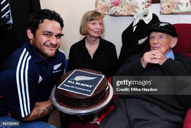 Piri Weepu of the New Zealand All Blacks and Molly Tindill present a birthday cake to former New Zealand All Black Eric Tindill as he celebrates his...