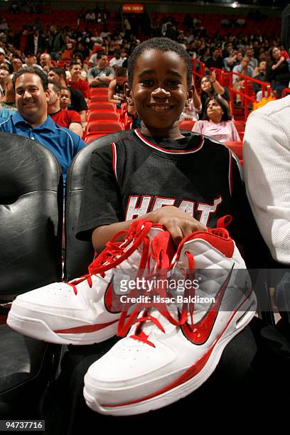 Miami Heat fan shows off the shows Jermaine O'Neal of the Miami Heat gave him on December 17, 2009 at American Airlines Arena in Miami, Florida. NOTE...