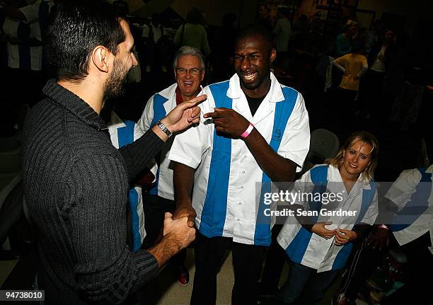 Peja Stojakovic and Julian Wright of the New Orleans Hornets share a laugh while while attending the 3rd Annual "Peja's Charitabowl" Fundraiser at...