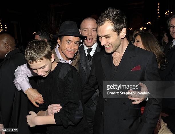 Giacomo Sumner, actor Robert Downey Jr., director Guy Ritchie, and actor Jude Law attend the after party for the premiere of "Sherlock Holmes" at The...