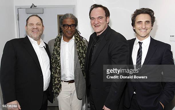Producer Harvey Weinstein, film critic Elvis Mitchell, director Quentin Tarantino and producer Lawrence Bender attend a screening of "Inglourious...