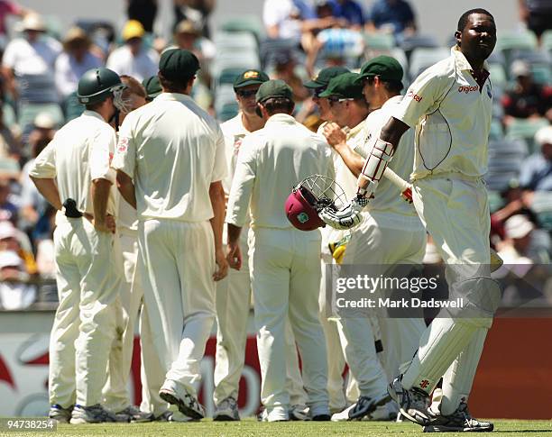 Sulieman Benn of the West Indies leaves the field after being caught behind by Brad Haddin of Australia off the bowling of Nathan Hauritz during day...