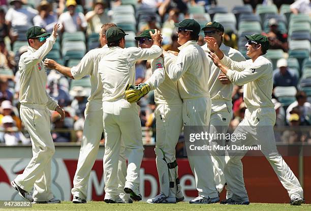 Australian players congratulate Brad Haddin of Australia after catching Sulieman Benn of the West Indies off the bowling of Nathan Hauritz during day...