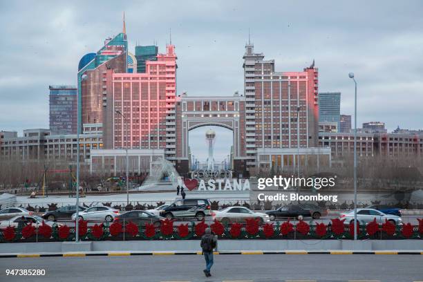 The Bayterek Tower is framed by the archway of the KazMunayGas national Co. Headquarters in Astana, Kazakhstan, on Friday, April 13, 2018....