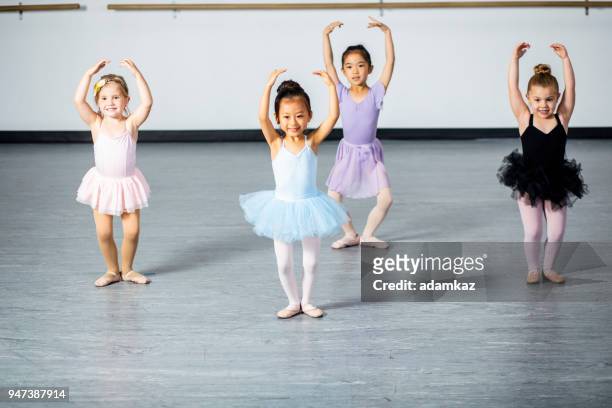 cute little ballerinas practicing in dance studio - children and art stock pictures, royalty-free photos & images