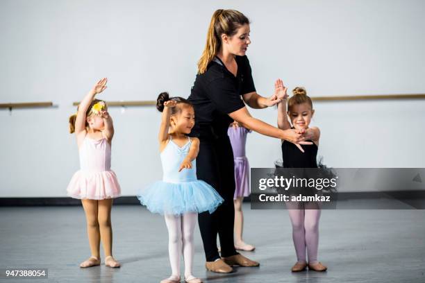 cute little ballerinas practicing in dance studio - choreographer stock pictures, royalty-free photos & images