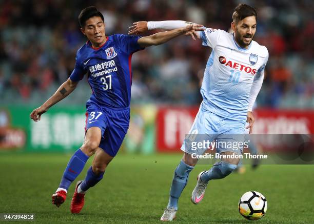 Milos Ninkovic of Sydney competes with Sun Shilin of Shanghai Shenhua FC during the AFC Champions League match between Sydney FC and Shaghai Shenhua...