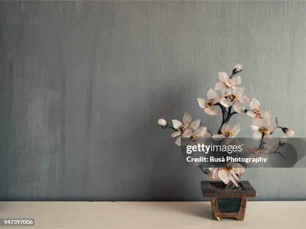 miniature cherry tree made of glass against a grey background - 花瓶 ストックフォトと画像