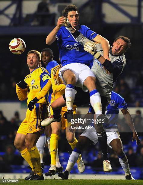 Bate goalkeeper Siarhei Vermko is challenged by Everton's Shane Duffy during their UEFA Europa League football match at Goodison Park in Liverpool,...