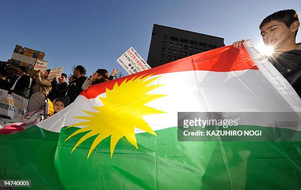 Turkish Kurds stage a demonstration march with the Kurdish flag in Tokyo on December 18, 2009. About 100 Turkish Kurds rallied in Tokyo, protesting a...