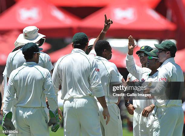 Makhaya Ntini of South Africa celebrates the wicket of Andrew Strauss of England for 46 runs during day 3 of the 1st Test match between South Africa...