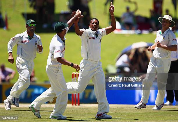 Makhaya Ntini of South Africa celebrates with his team mates after taking the wicket of Andrew Strauss of England for 46 runs during day three of the...