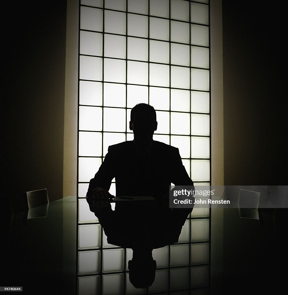 Business man or boss in silhouette interview