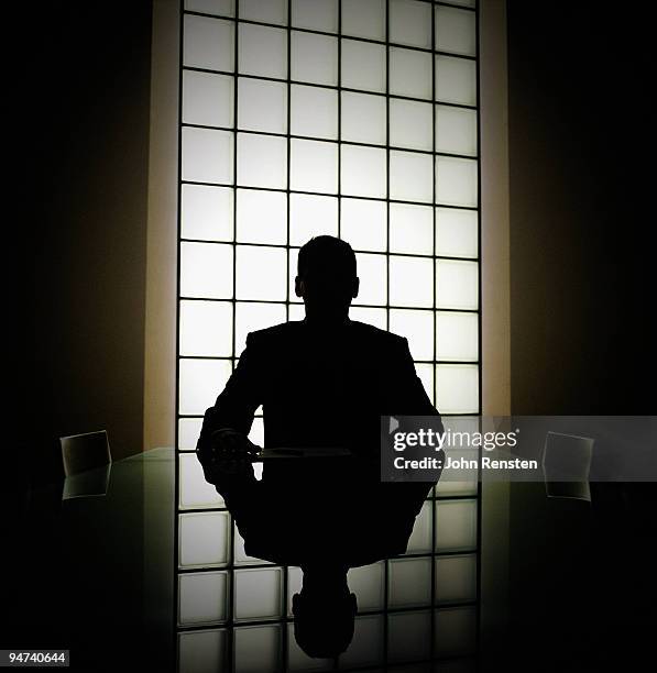 business man or boss in silhouette interview - schlagschatten stock-fotos und bilder