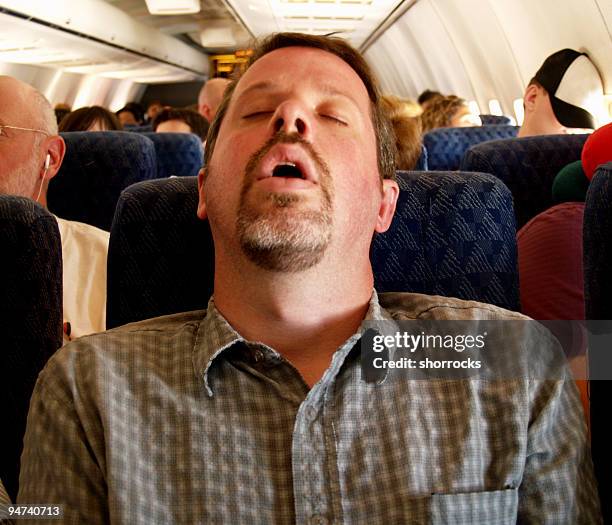 tiring flight - man mouth open stock pictures, royalty-free photos & images