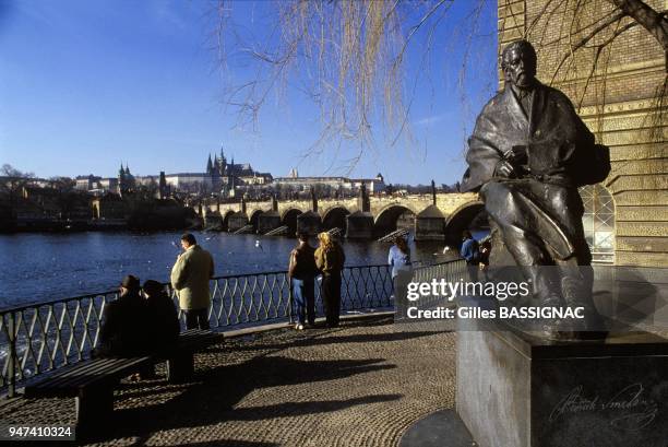 The Statue Of Musician Smetana, The Moldau River And Charles Bridge In Prague, February 1990.