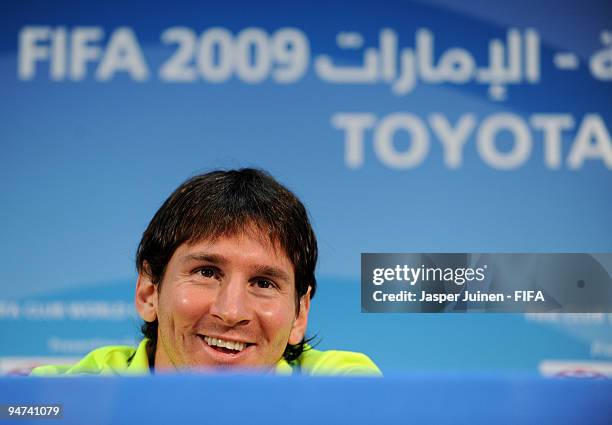 Lionel Messi of FC Barcelona answers questions for the media during a press conference at the Zayed Sports City stadium on December 18, 2009 in Abu...