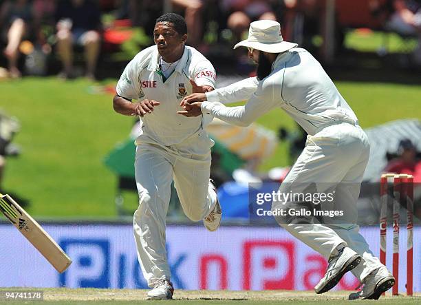 Makhaya Ntini and Hashim Amla of South Africa in a near collision during day 3 of the 1st Test match between South Africa and England from Supersport...