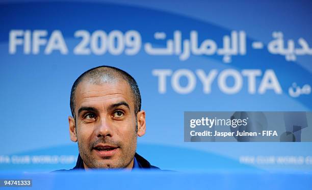 Head coach Josep Guardiola of FC Barcelona answers questions from the media during a press conference at the Zayed Sports City stadium on December...