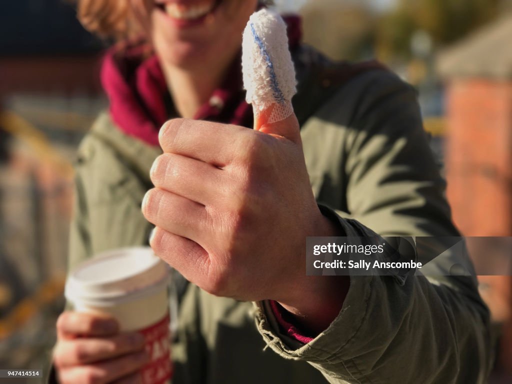 Woman with a bandaged thumb