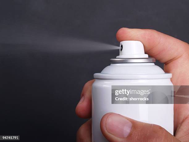 aerosol can - spray on hand stock pictures, royalty-free photos & images