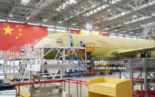 Photo taken on May 4 shows a second unit of the C919, China's first domestically built jetliner, under construction at a factory operated by...