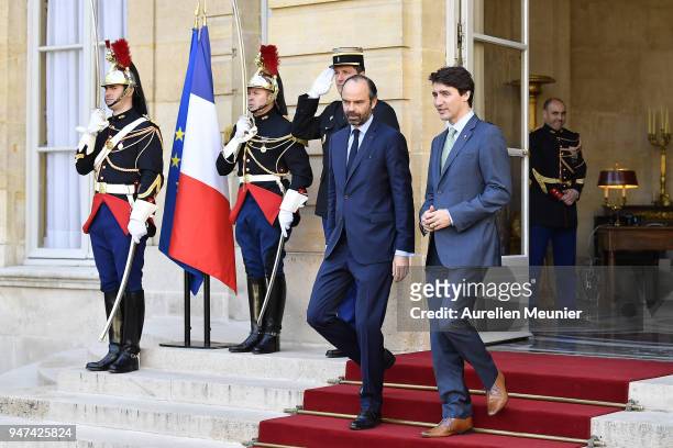 French Prime Minister Edouard Philippe escorts Canadian Prime Minister Justin Trudeau after a meeting at Hotel de Matignon on April 17, 2018 in...