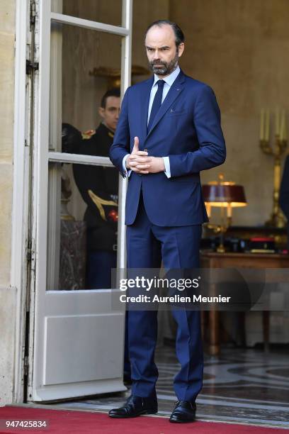 French Prime Minister Edouard Philippe waits for Canadian Prime Minister Justin Trudeau for a meeting at Hotel de Matignon on April 17, 2018 in...