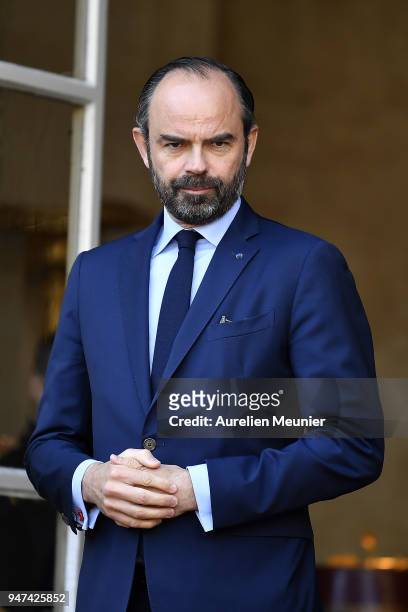 French Prime Minister Edouard Philippe waits for Canadian Prime Minister Justin Trudeau for a meeting at Hotel de Matignon on April 17, 2018 in...