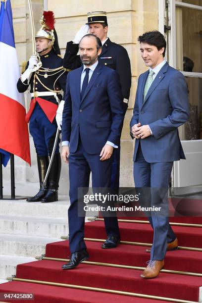 French Prime Minister Edouard Philippe escorts Canadian Prime Minister Justin Trudeau after a meeting at Hotel de Matignon on April 17, 2018 in...