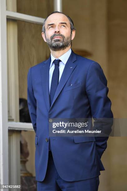 French Prime Minister Edouard Philippe waits for Canadian Prime Minister Justin Trudeau for a meeting at Hotel de Matignon on April 17, 2018 in...