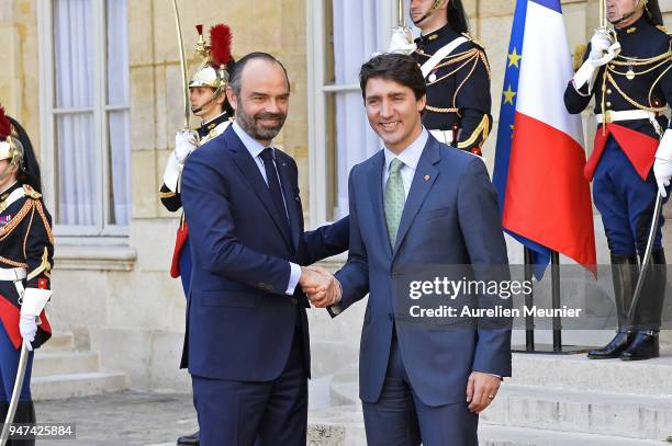 French Prime Minister Edouard Philippe welcomes Canadian Prime Minister Justin Trudeau for a meeting at Hotel de Matignon on April 17, 2018 in Paris,...