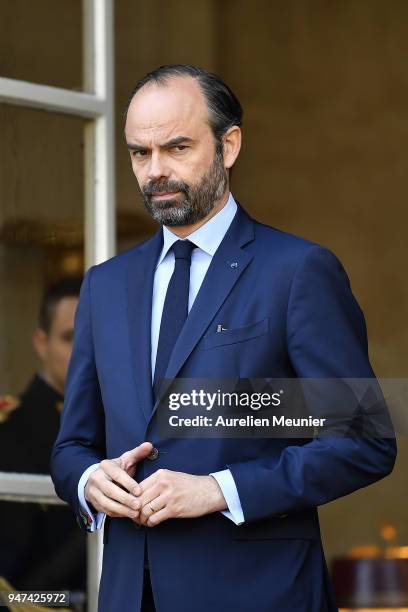 French Prime Minister Edouard Philippe waits for Canadian Prime Minister Justin Trudeau for a meeting at Hotel de Matignon on April 17, 2018 in...