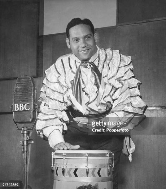Trinidadian singer and bandleader Edmundo Ros performing in a BBC radio studio, London, 7th October 1949.