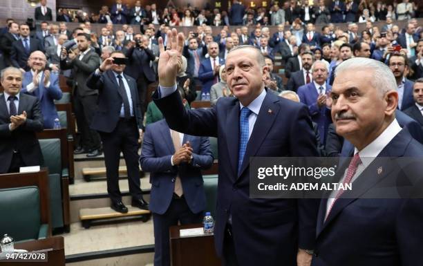 President of Turkey and Leader of the Justice and Development Party , Recep Tayyip Erdogan , waves as he arrives flanked by Prime Minister of Turkey...