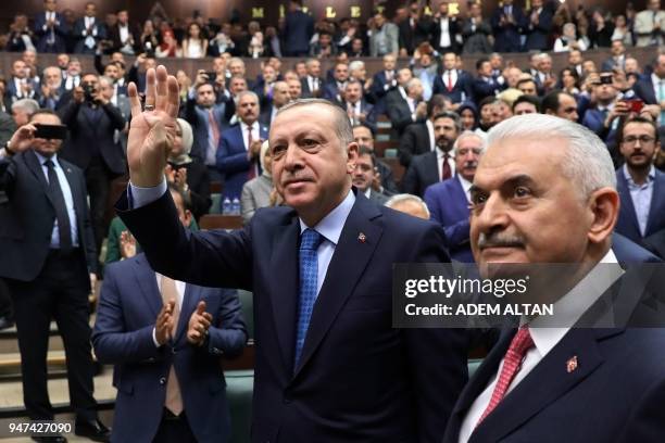 President of Turkey and Leader of the Justice and Development Party , Recep Tayyip Erdogan , waves as he arrives flanked by Prime Minister of Turkey...