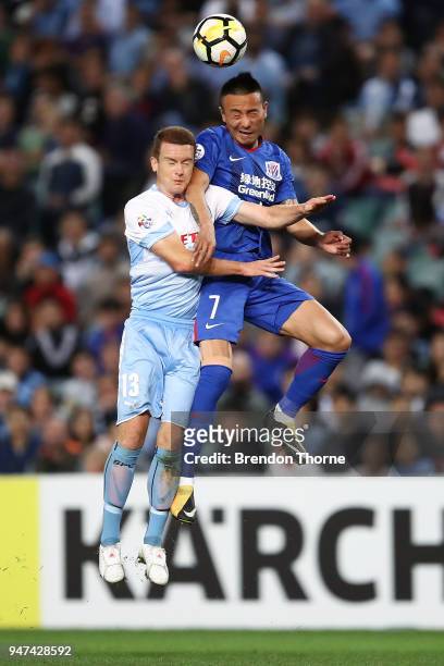 Brandon O'Neill of Sydney competes with Mao Jianqing of Shanghai Shenhua FC during the AFC Champions League match between Sydney FC and Shaghai...