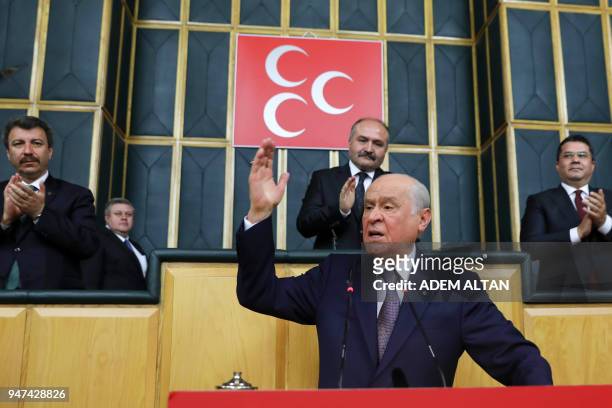 Devlet Bahceli, who heads the Nationalist Movement Party , gestures as he speaks during a meeting of his party at the Grand National Assembly of...