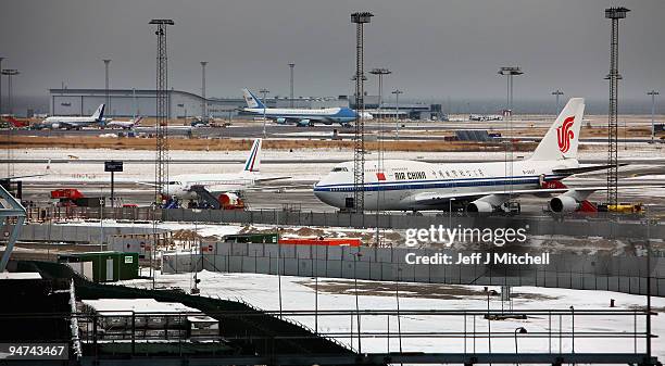 Air Force One and the plane of Chinese Prime Minister Wen Jiabao sit on the tarmac along with other aircraft waiting to return World leaders home,...