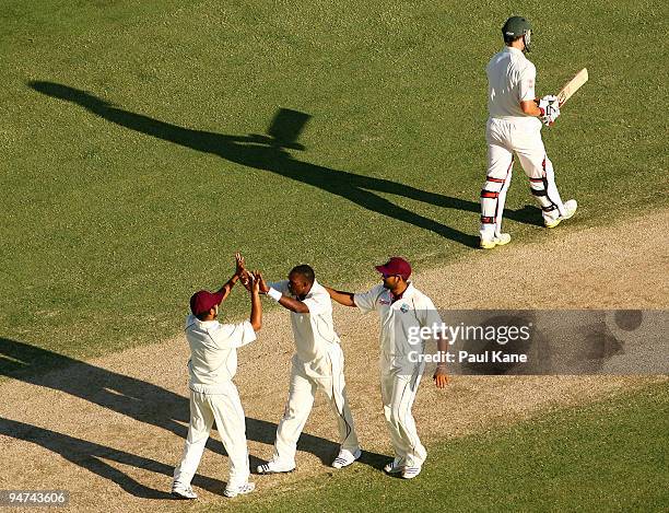 Dwayne Bravo of the West Indies celebrates the wicket of Mitchell Johnson during day three of the Third Test match between Australia and the West...