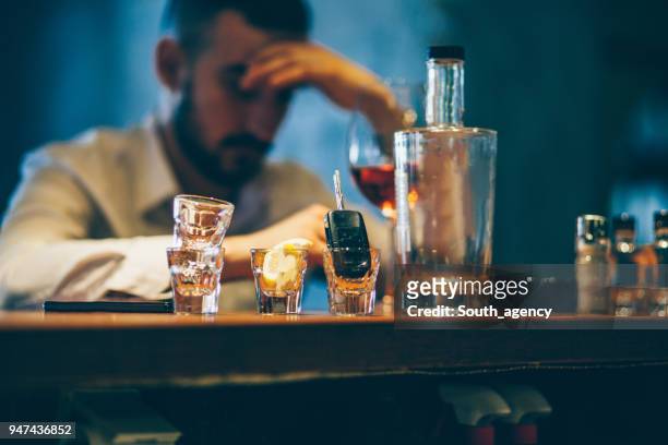 drinking alone - alcohol abuse stock pictures, royalty-free photos & images