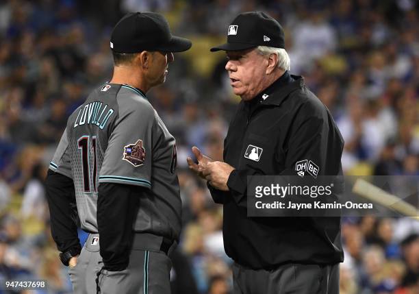 Umpire Brian Gorman explains the ruling on the field to overturn a home run call to manager Torey Lovullo of the Arizona Diamondbacks in the fourth...