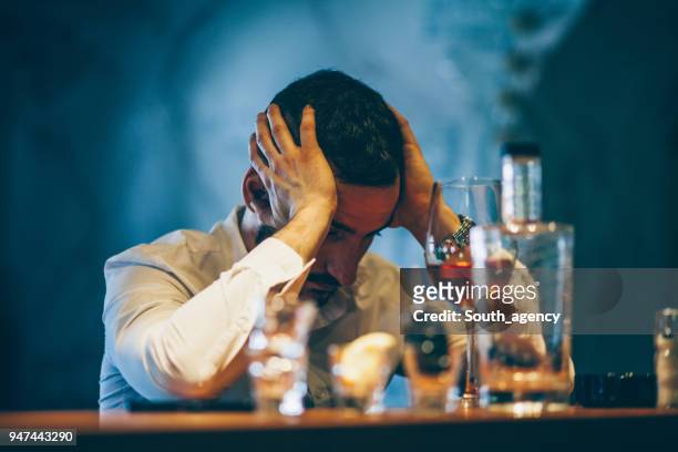 drinking all day in bar - binge drinking stock pictures, royalty-free photos & images