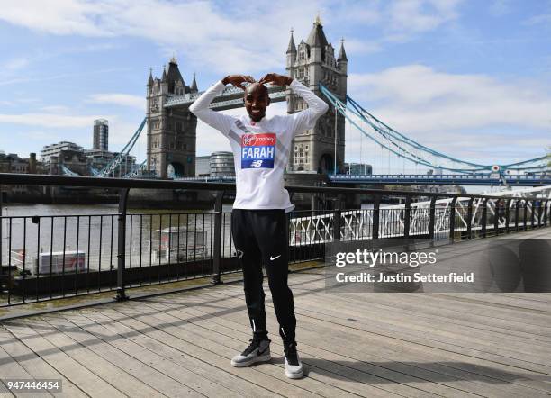 Mo Farah of Great Britain poses in front of Tower Bridge prior to the weekends Virgin Money London Marathon on April 17, 2018 in London, England.