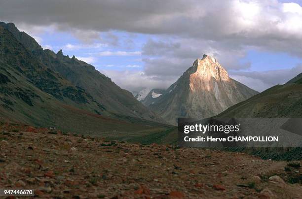 The Gumburanjon Mountain. To reach the Shingo La pass, travelers pass by at the foot of this mountain, majestically pointing towards the sky and...