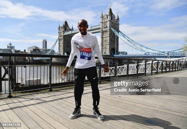 Mo Farah of Great Britain poses in front of Tower Bridge prior to the weekends Virgin Money London Marathon on April 17, 2018 in London, England.